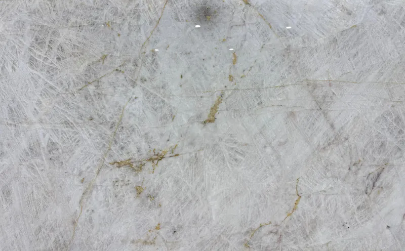 Cristallo quartzite, slab AC-03: a full slab in icy white with a fine web and gold veins