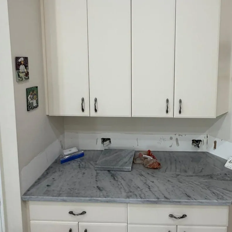 Side counter with a new gray veined top, before the backsplash went in