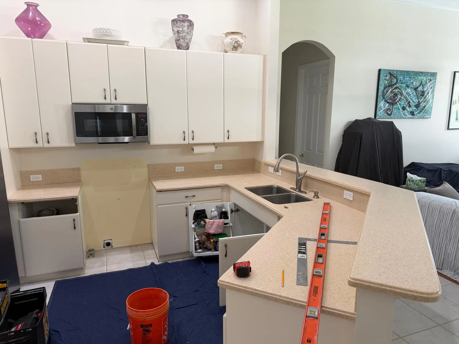 Kitchen before: old laminate countertops on the same cabinets