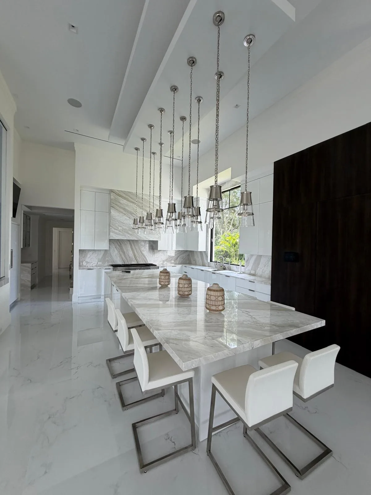 Open kitchen with stone island and matching stone dining table